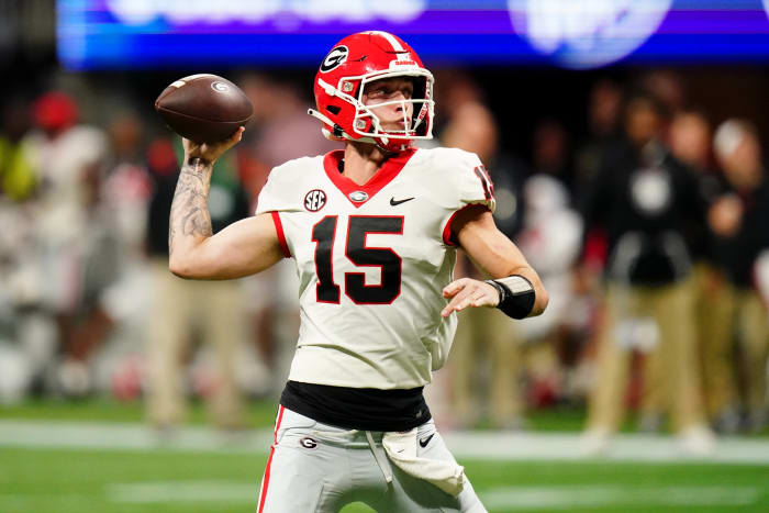 Dec 2, 2023; Atlanta, GA, USA; Georgia Bulldogs quarterback Carson Beck (15) throws a pass against the Alabama Crimson Tide in the third quarter of the SEC Championship at Mercedes-Benz Stadium.